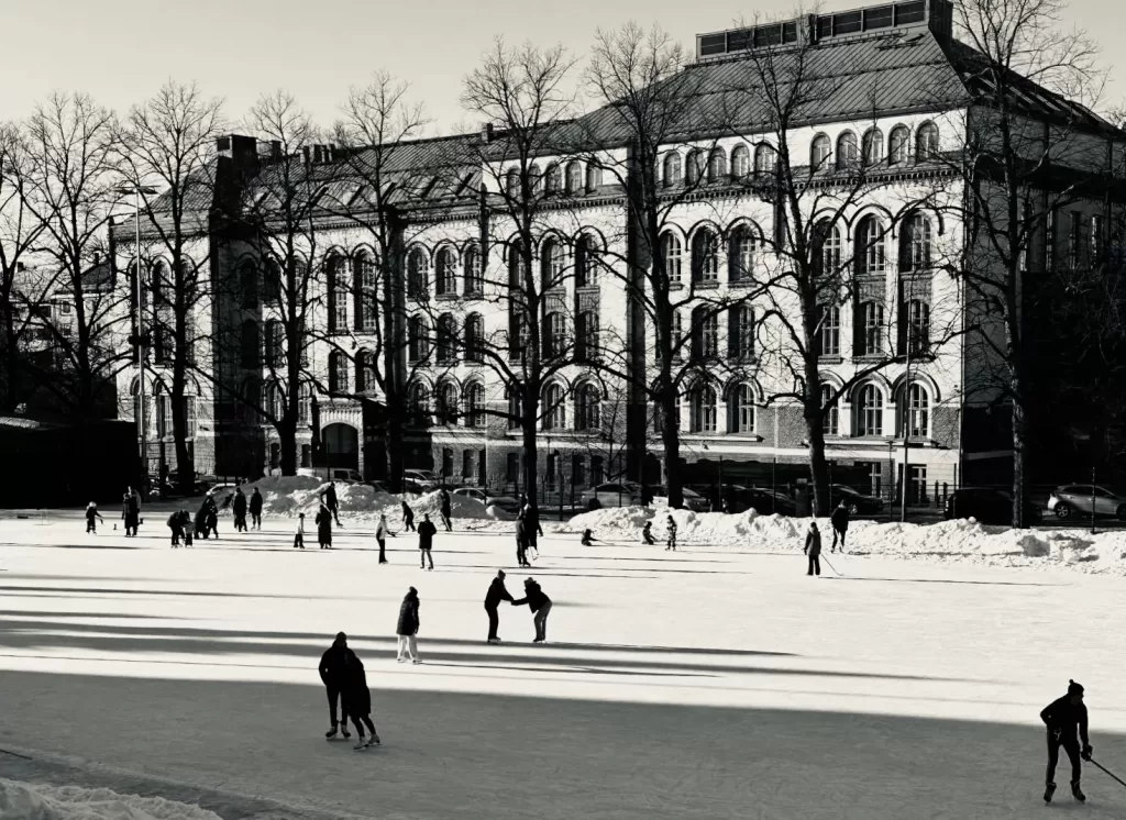 beautiful outside ice rink with shadows from the sunshine on an architectural backdrop