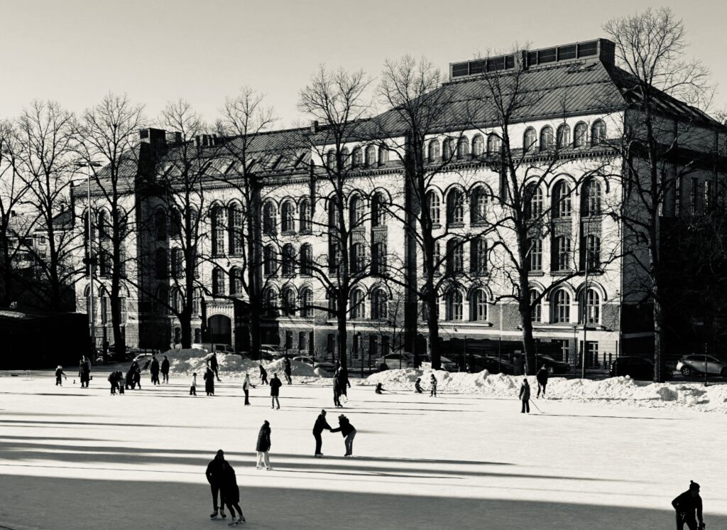 beautiful outside ice rink with shadows from the sunhine on an architecural backdrop